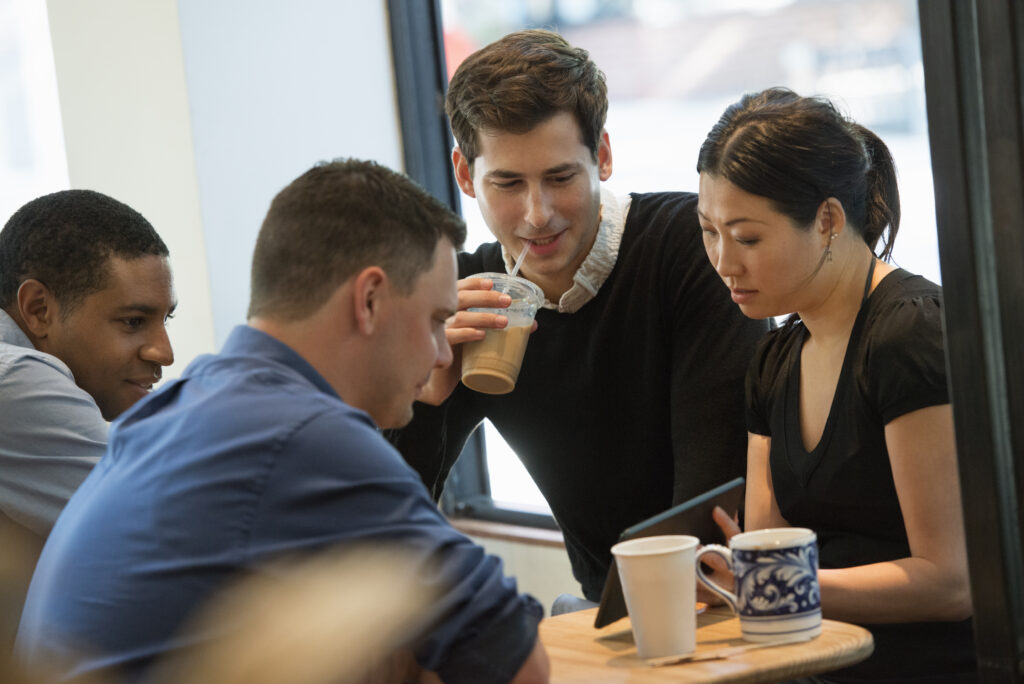 A group of direct marketing interns in a huddle