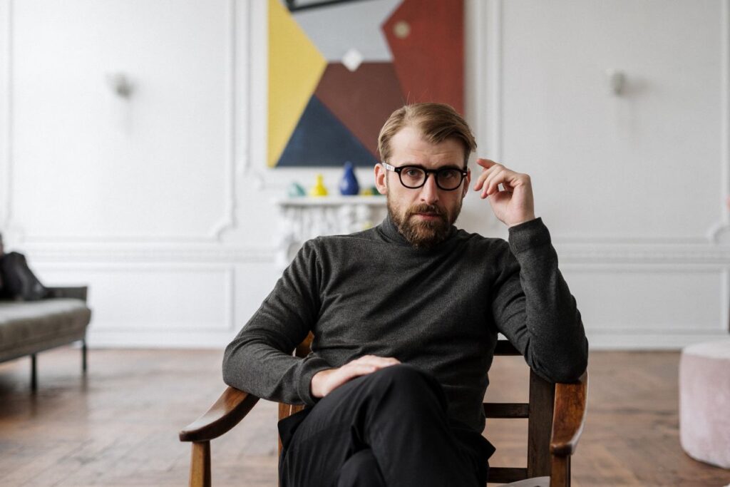 A brand visibility expert sitting in a chair