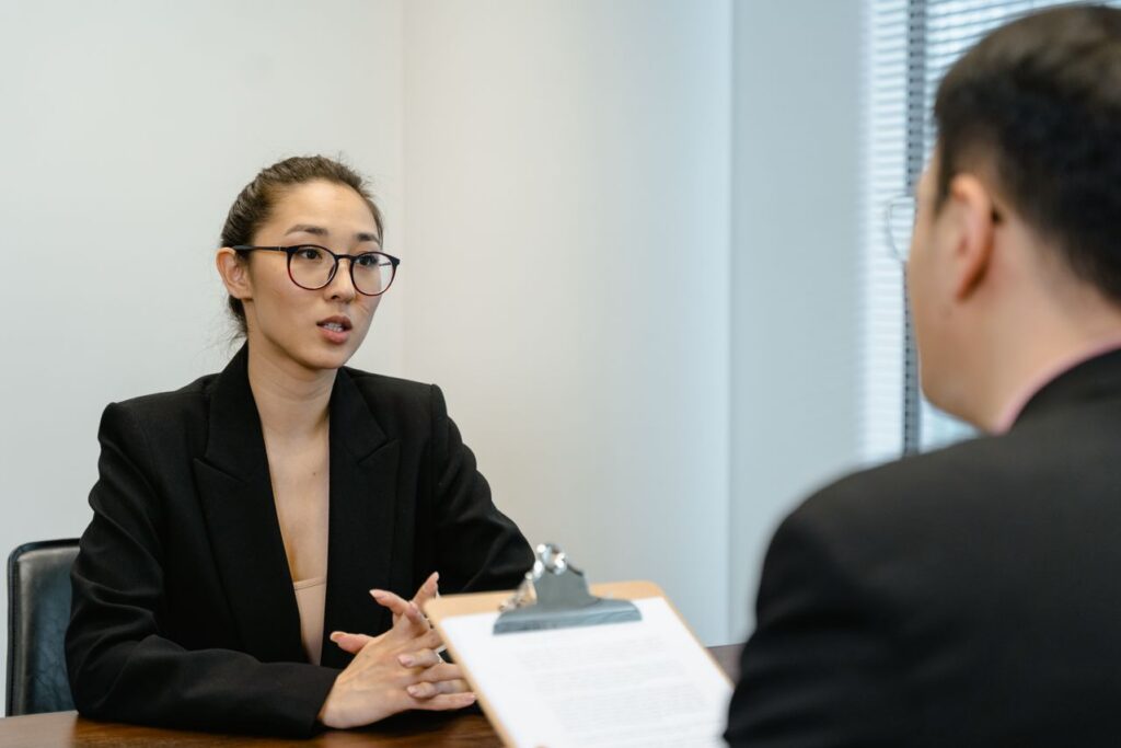 An applicant answering interview questions for a sales position